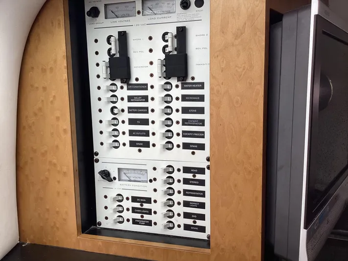  Yacht Photos Pics Electrical panel on a 2008 Donzi 38 ZSF boat, featuring various labeled switches.