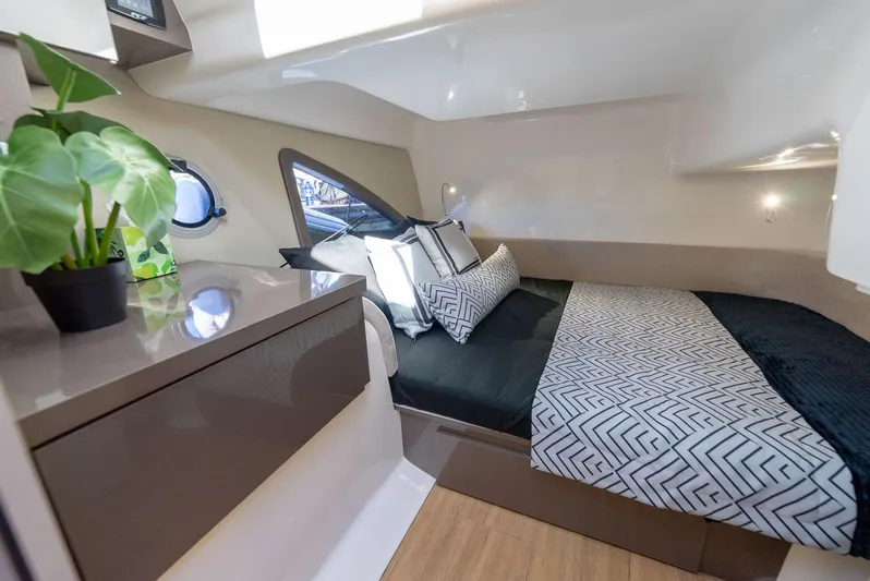Music Yacht Photos Pics Luxurious cabin interior of 2024 Hanover 415 yacht with modern bedding and decor.