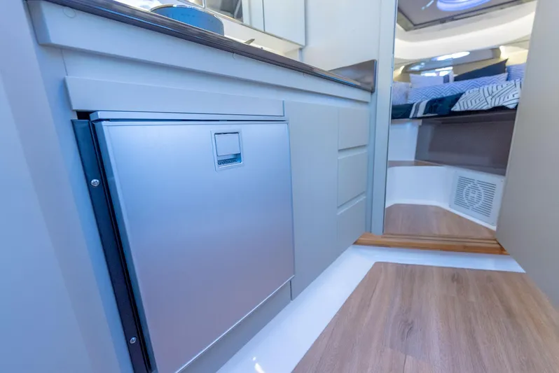 Music Yacht Photos Pics Modern interior of Hanover 415 yacht, featuring sleek cabinetry and cozy sleeping area, 2024 model.