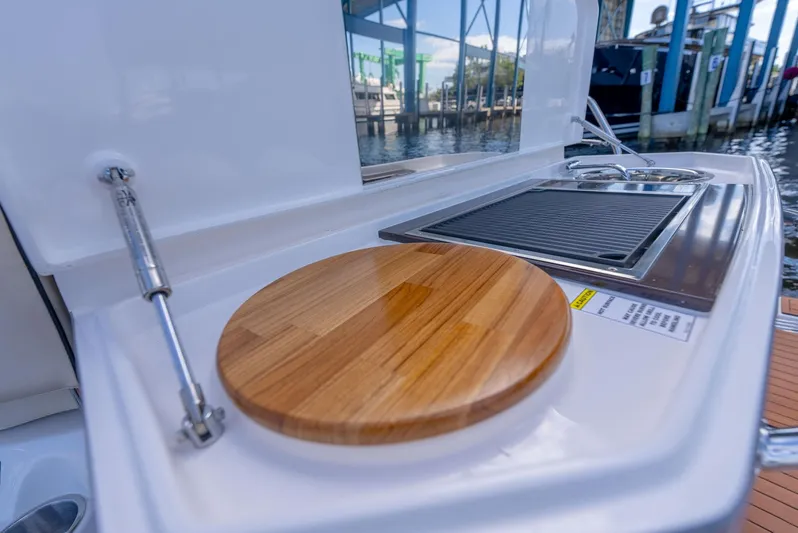 Music Yacht Photos Pics Outdoor kitchen on 2024 Hanover 415 yacht with cutting board and grill.
