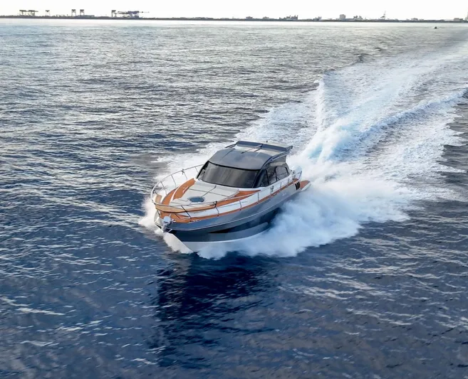 Music Yacht Photos Pics 2024 Hanover 415 yacht cruising swiftly on open water.