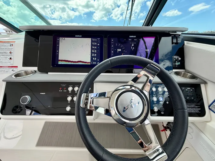  Yacht Photos Pics Sea Ray Sundancer 320 Outboard 2025 helm with Simrad displays.