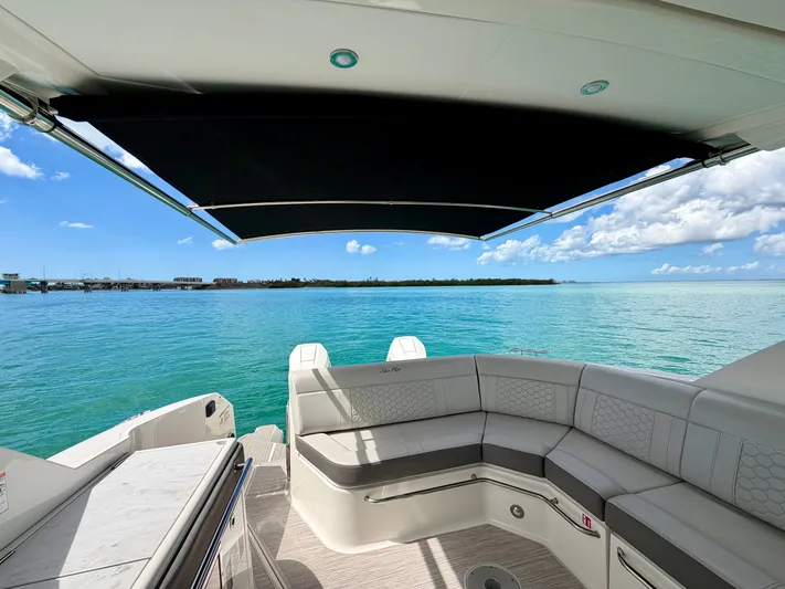  Yacht Photos Pics 2025 Sea Ray Sundancer 320 Outboard overlooking the sea.