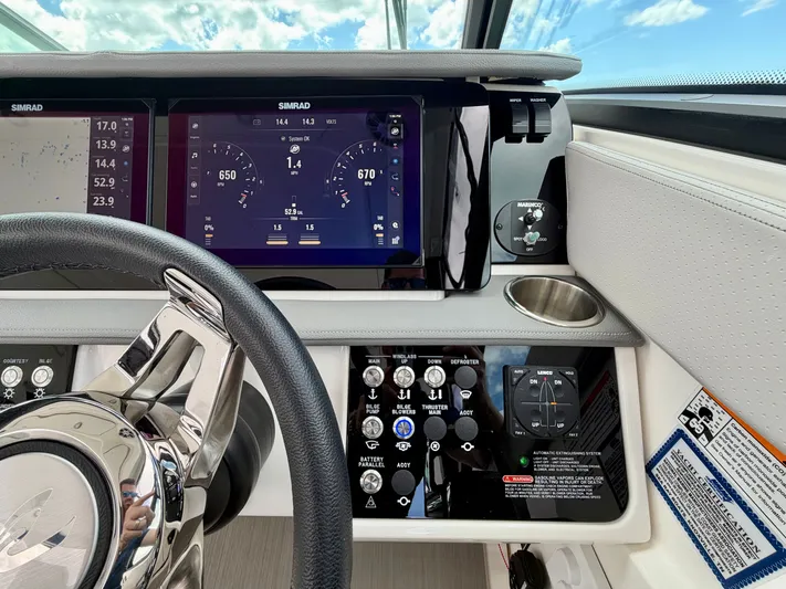  Yacht Photos Pics 2025 Sea Ray Sundancer 320 Outboard cockpit with modern instruments.