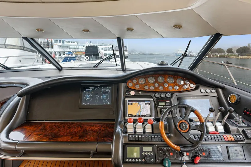 Blue Steel Yacht Photos Pics Cockpit of 1998 Sunseeker Predator 80 yacht with advanced navigation controls and steering wheel.