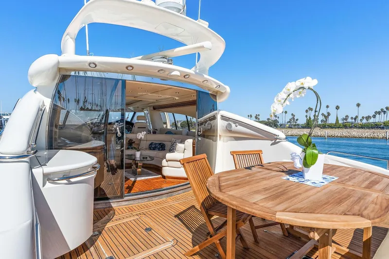 Blue Steel Yacht Photos Pics Luxurious 1998 Sunseeker Predator 80 yacht with elegant deck and seating area.