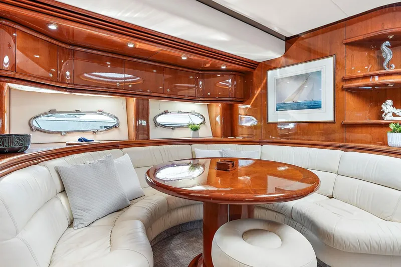 Blue Steel Yacht Photos Pics Luxurious interior of 1998 Sunseeker Predator 80 yacht with elegant wood and leather seating.