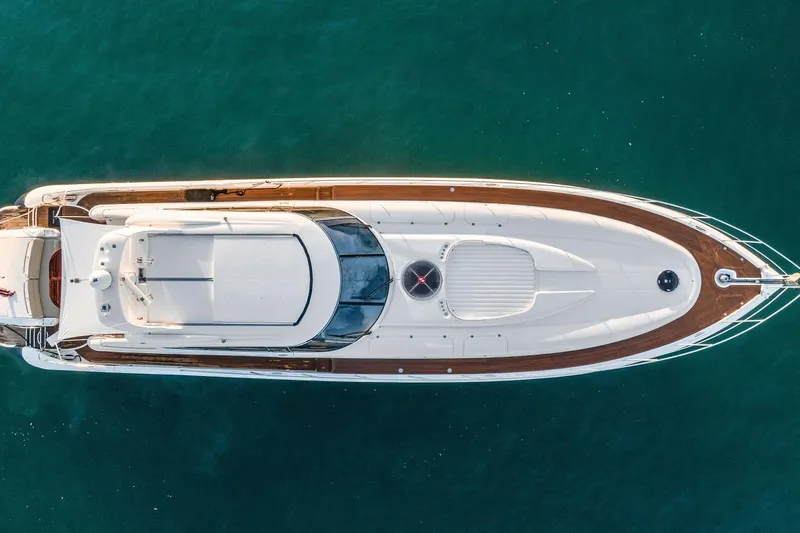 Blue Steel Yacht Photos Pics Overhead view of 1998 Sunseeker Predator 80 yacht on clear blue water.