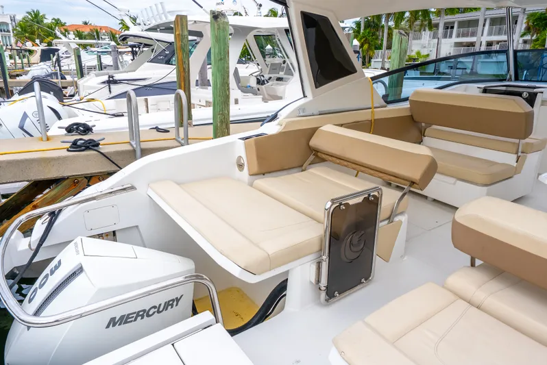 Ohana Yacht Photos Pics Aquila 32 boat interior with beige seating, docked at marina, 2020 model.