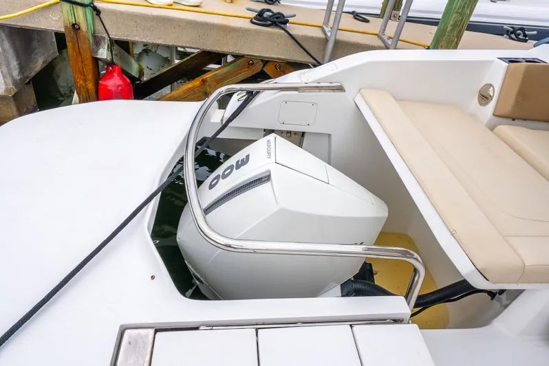 Ohana Yacht Photos Pics Aquila 32 boat with Mercury 300 engine, docked, featuring beige seating, 2020 model.