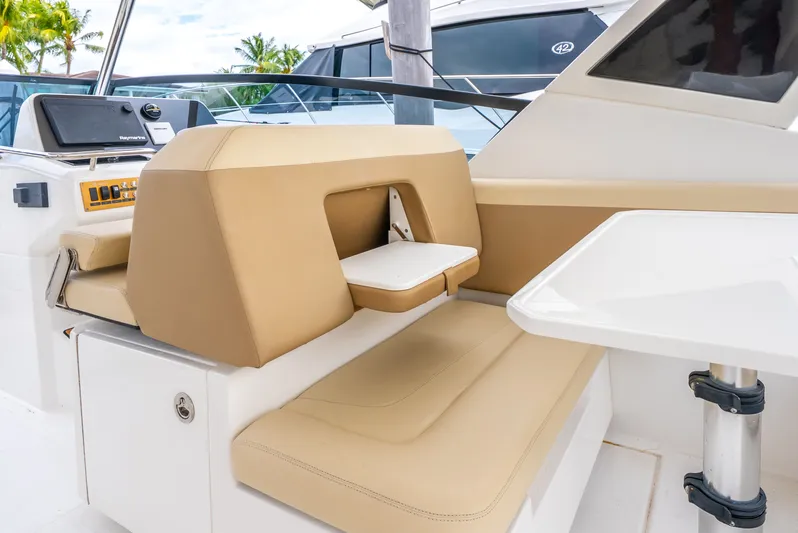 Ohana Yacht Photos Pics Aquila 32 yacht interior, featuring beige seating and a white table, 2020 model.