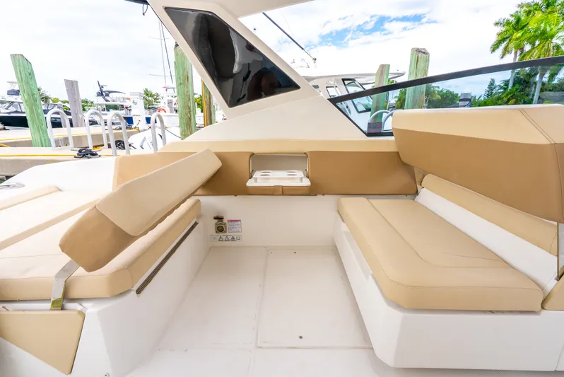 Ohana Yacht Photos Pics Interior seating of 2020 Aquila 32 boat with beige cushions and modern design.