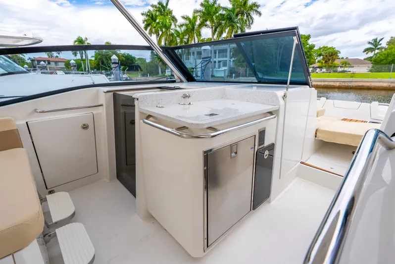 Ohana Yacht Photos Pics Luxury Aquila 32 yacht interior with kitchenette, featuring sleek design and modern amenities, 2020 model.