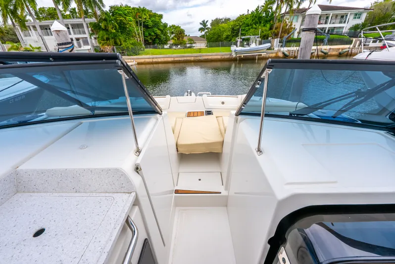 Ohana Yacht Photos Pics Aquila 32 yacht interior, 2020 model, docked by a serene waterfront.