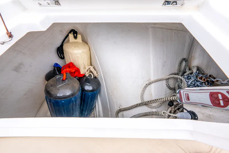 Ohana Yacht Photos Pics Storage compartment on a 2020 Aquila 32 boat with fenders and ropes.
