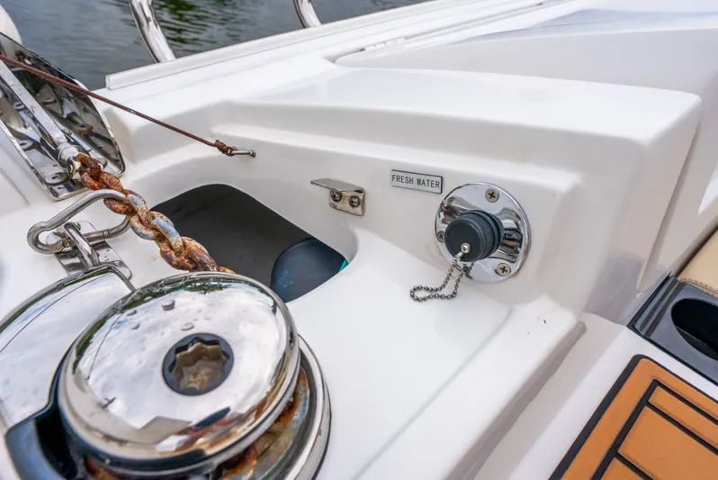 Ohana Yacht Photos Pics Aquila 32 boat deck with anchor chain and fresh water access, 2020 model.