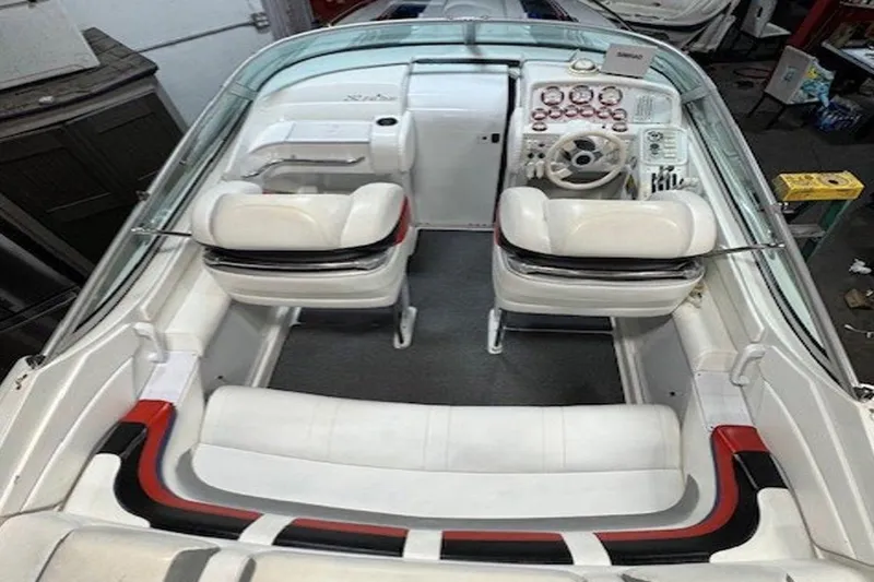  Yacht Photos Pics 2004 Formula 292 FASTech boat interior with white seating and dashboard controls.