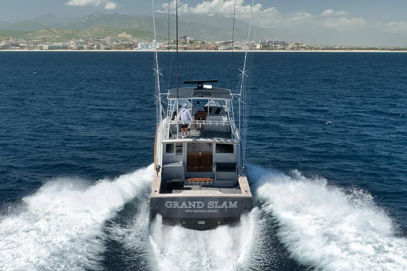 Grand Slam Yacht Photos Pics 2004 Guthrie 60 Custom Carolina yacht cruising on open sea near coastline.