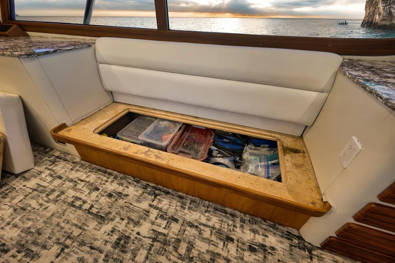 Grand Slam Yacht Photos Pics Interior of 2004 Guthrie 60 Custom Carolina with under-seat storage and ocean view.