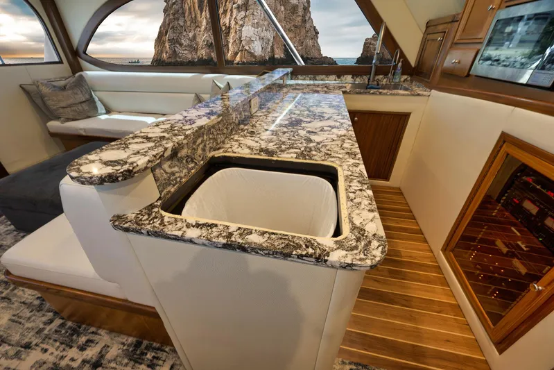 Grand Slam Yacht Photos Pics Luxurious 2004 Guthrie 60 Custom Carolina yacht interior with marble countertops and scenic window view.