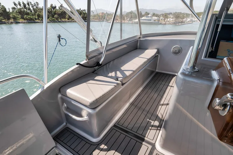 Grand Slam Yacht Photos Pics 2004 Guthrie 60 Custom Carolina boat deck with cushioned seating and scenic water view.