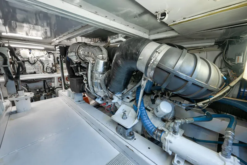 Grand Slam Yacht Photos Pics Engine room of 2004 Guthrie 60 Custom Carolina boat, showcasing machinery and components.