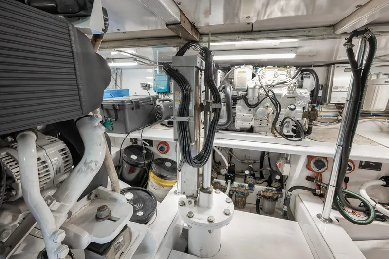 Grand Slam Yacht Photos Pics Engine room of 2004 Guthrie 60 Custom Carolina boat, showcasing mechanical components and wiring.