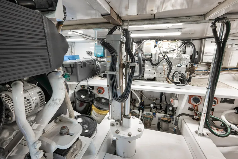 Grand Slam Yacht Photos Pics Engine room of 2004 Guthrie 60 Custom Carolina boat, showcasing mechanical components and wiring.