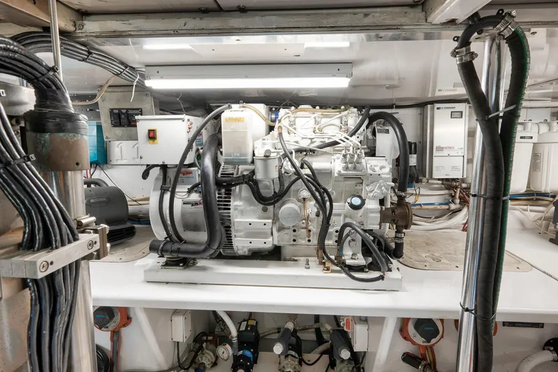 Grand Slam Yacht Photos Pics Engine room of 2004 Guthrie 60 Custom Carolina boat, featuring complex machinery and wiring.