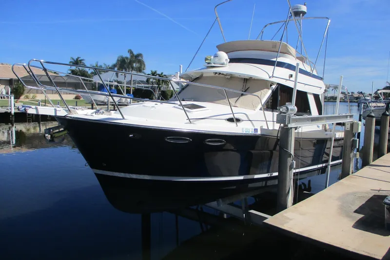 I'm Busy Yacht Photos Pics 2015 Cutwater 30 Command Bridge LE boat docked in sunny marina.