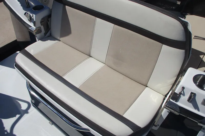 I'm Busy Yacht Photos Pics 2015 Cutwater 30 Command Bridge LE boat seat with beige and white upholstery.