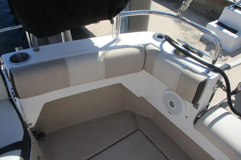 I'm Busy Yacht Photos Pics 2015 Cutwater 30 Command Bridge LE boat seating area with cup holders and speaker.