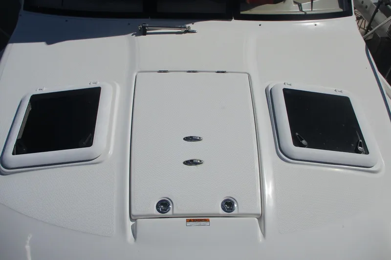 I'm Busy Yacht Photos Pics 2015 Cutwater 30 Command Bridge LE boat deck with hatches and textured surface.