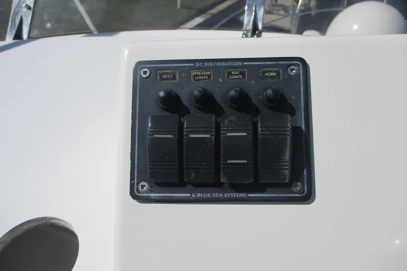 I'm Busy Yacht Photos Pics Control panel on 2015 Cutwater 30 Command Bridge LE boat, featuring switches for lights and horn.