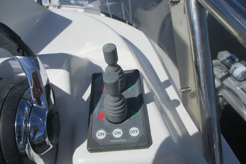 I'm Busy Yacht Photos Pics Control panel of 2015 Cutwater 30 Command Bridge LE boat with joystick and buttons.