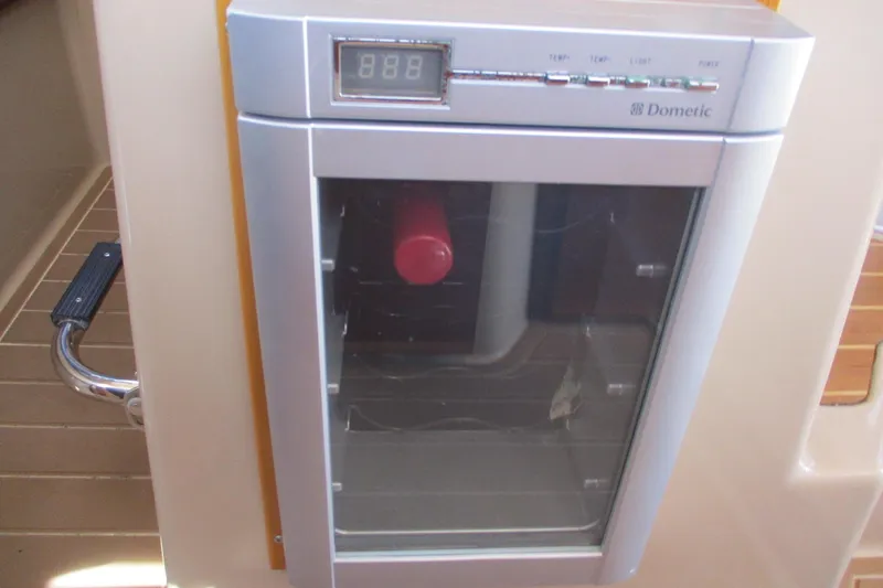 I'm Busy Yacht Photos Pics Dometic fridge on 2015 Cutwater 30 Command Bridge LE boat interior.