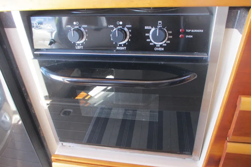 I'm Busy Yacht Photos Pics Oven controls on 2015 Cutwater 30 Command Bridge LE boat kitchen.