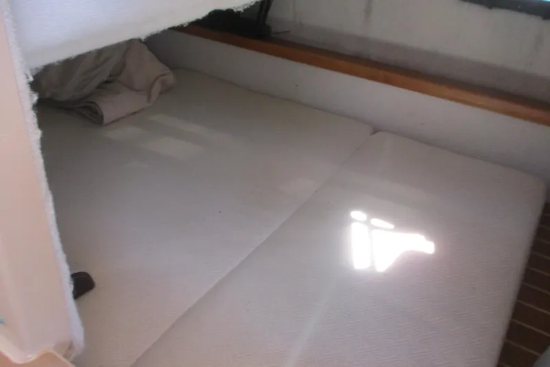 I'm Busy Yacht Photos Pics Interior cabin of 2015 Cutwater 30 Command Bridge LE with cozy bedding.