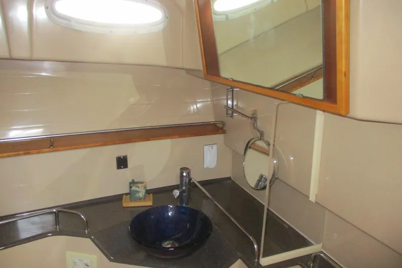 I'm Busy Yacht Photos Pics 2015 Cutwater 30 Command Bridge LE bathroom with modern sink and mirror.