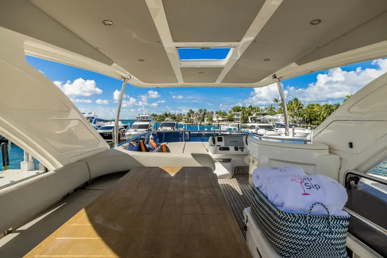 Sipsip Yacht Photos Pics Luxurious 2018 Absolute 52 FLY yacht interior with marina view and elegant seating area.