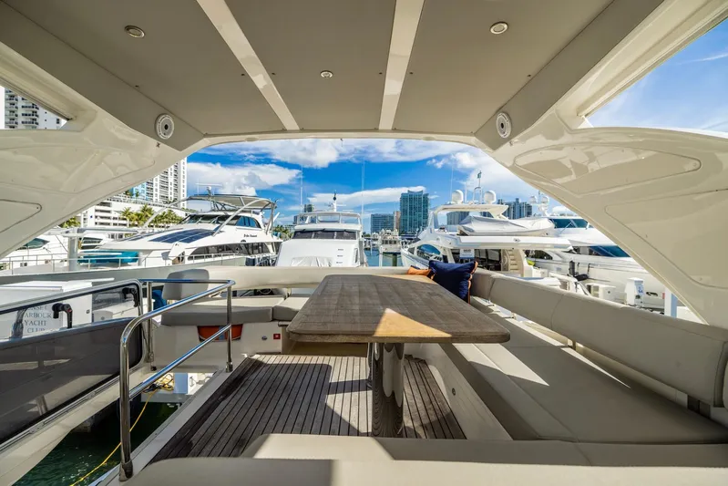 Sipsip Yacht Photos Pics Luxurious 2018 Absolute 52 FLY yacht interior with spacious seating and marina view.