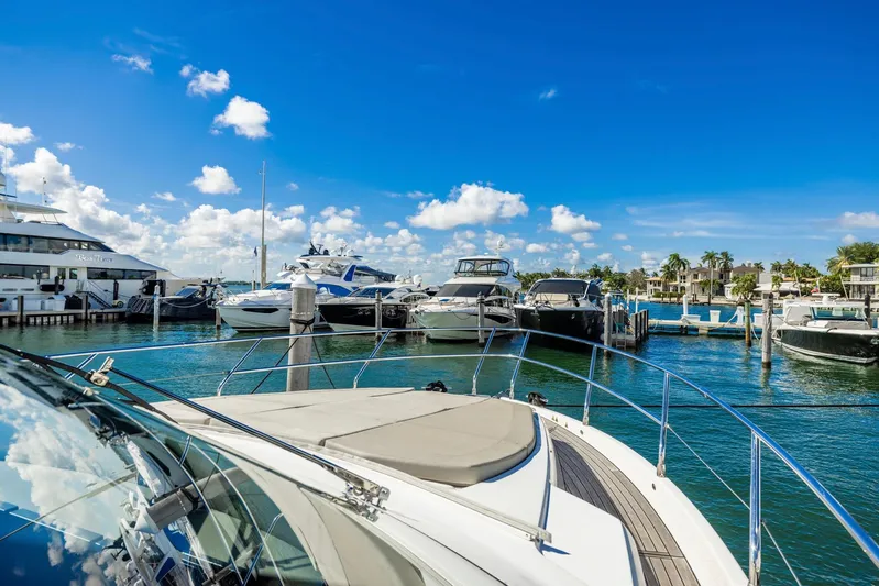 Sipsip Yacht Photos Pics Luxurious Absolute 52 FLY yacht docked in a sunny marina, 2018 model.