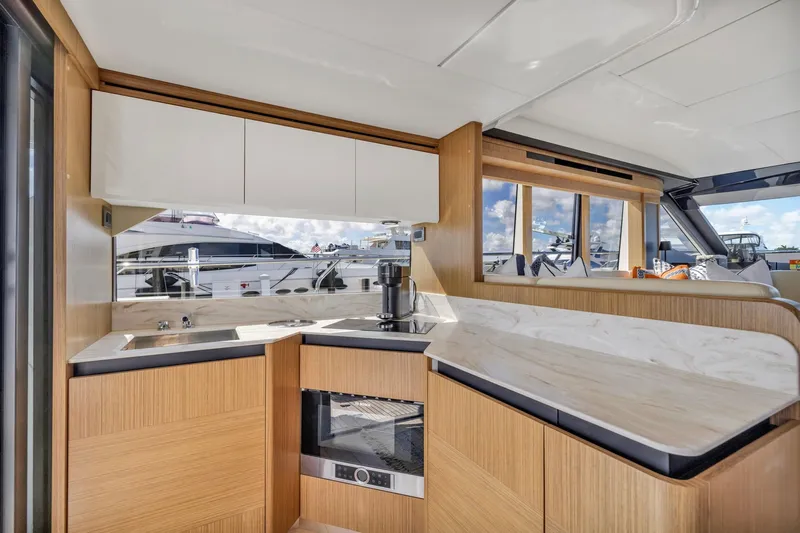 Sipsip Yacht Photos Pics Luxurious kitchen interior of 2018 Absolute 52 FLY yacht with modern design and appliances.