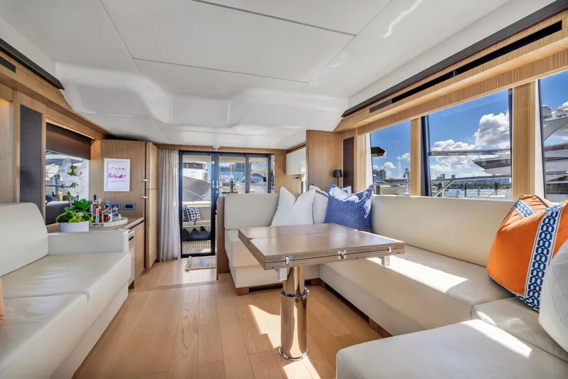 Sipsip Yacht Photos Pics Luxurious interior of 2018 Absolute 52 FLY yacht with elegant seating and panoramic windows.
