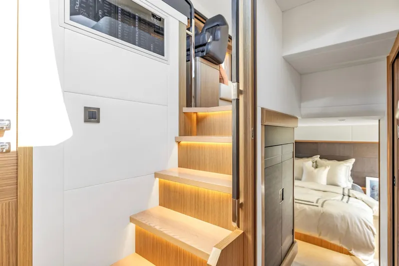 Sipsip Yacht Photos Pics Interior of 2018 Absolute 52 FLY yacht with wooden stairs and cozy bedroom.