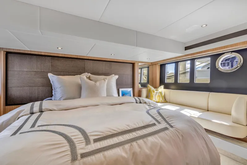 Sipsip Yacht Photos Pics Luxurious bedroom interior of 2018 Absolute 52 FLY yacht with elegant bedding and seating.
