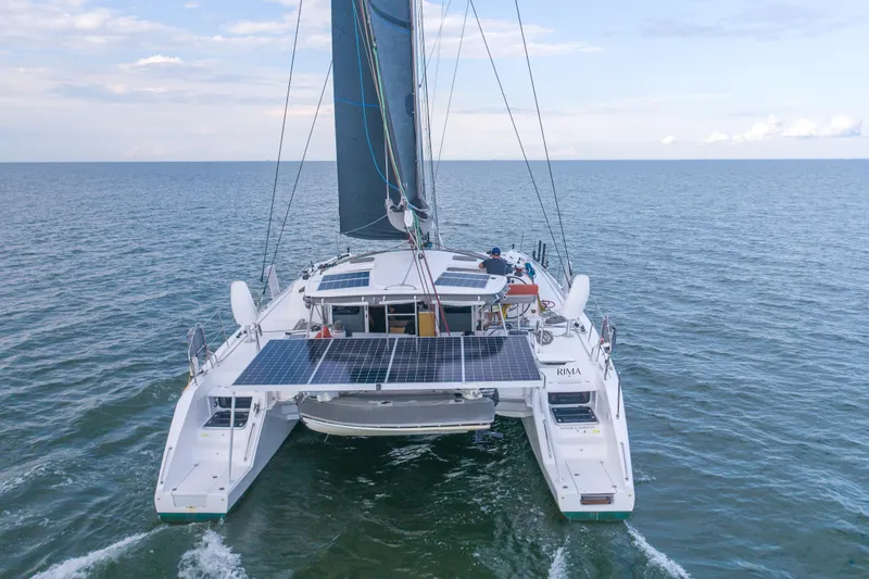Rima Yacht Photos Pics 2018 Outremer 51 catamaran sailing on open sea with solar panels visible.