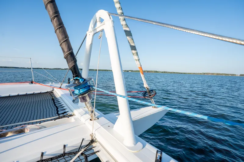 Rima Yacht Photos Pics 2018 Outremer 51 catamaran sailing on calm blue waters under clear skies.