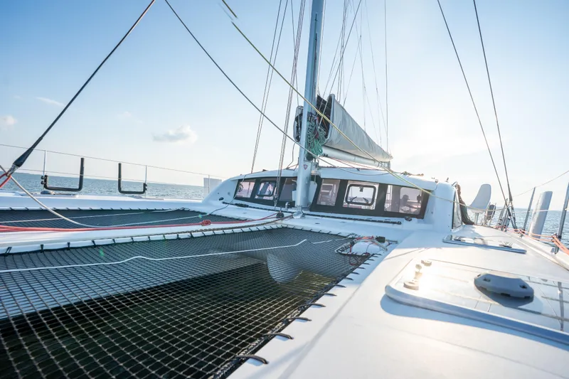 Rima Yacht Photos Pics 2018 Outremer 51 catamaran deck with sails, ocean view, and clear sky.