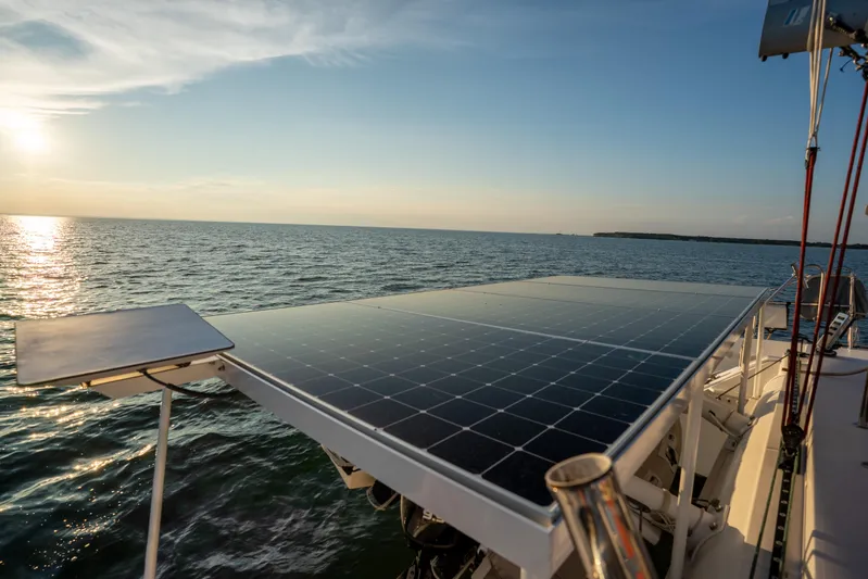 Rima Yacht Photos Pics Outremer 51 catamaran with solar panels at sunset, 2018 model, on open sea.